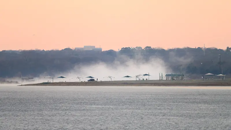 Pink sunrise over Grapevine Lake at Murrell Park in Flower Mound, Texas